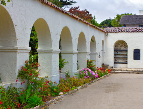 Public garden with Spanish adobe arched walls in Monterey, California